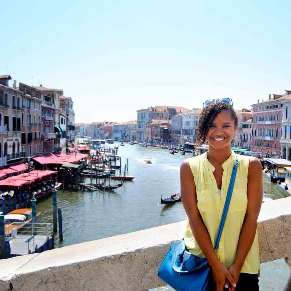 Person standing on bridge in Venice, Italy
